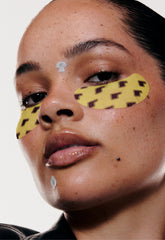 model wears peptide eye prep banana peel, spotwear shroom + daisy
