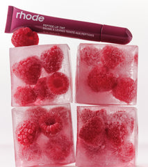 Raspberry Jelly lip tint on top of raspberry ice cubes
