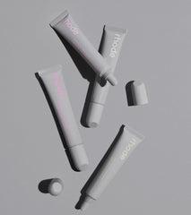 rhode peptide lip treatment in rhode vanilla, unscented, salted caramel, and watermelon slice