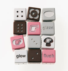 a collection of white, grey, and pink dice 