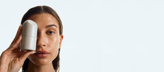 hailey bieber with glazed skin, holding peptide glazing fluid