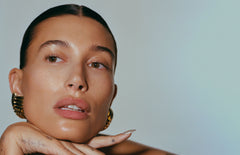 Hailey Bieber with glazed skin and glossy lips