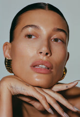 hailey bieber with glazed skin, wearing peptide glazing fluid