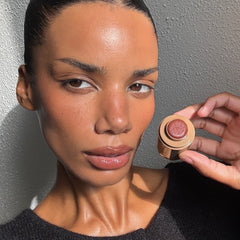 Model holding Pocket Blush in Toasted Teddy