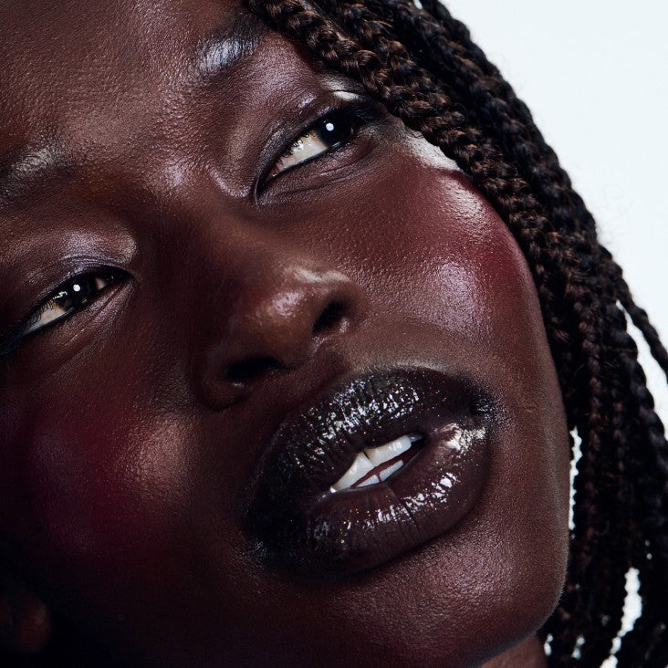 model wearing peptide lip tint jelly bean
