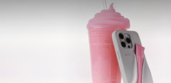 rhode lip case with ribbon lip tint, next to a pink slushie