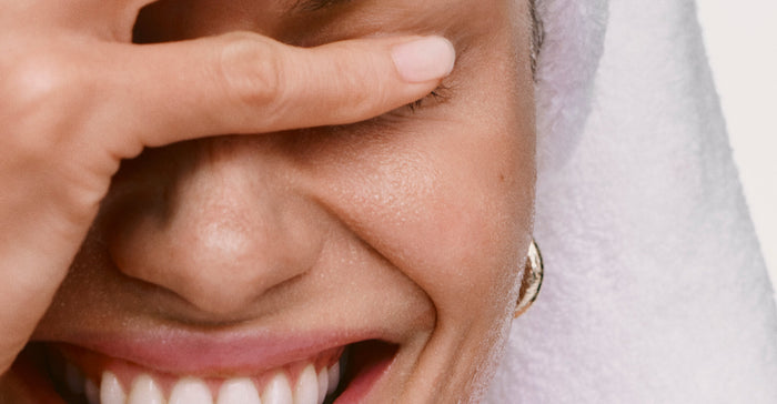 model after cleansing her face with pineapple refresh