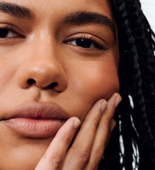 model wearing peptide lip shape in twist