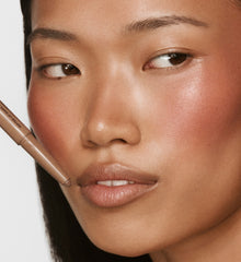 A VOLUMIZING lip shaper for contoured lips.