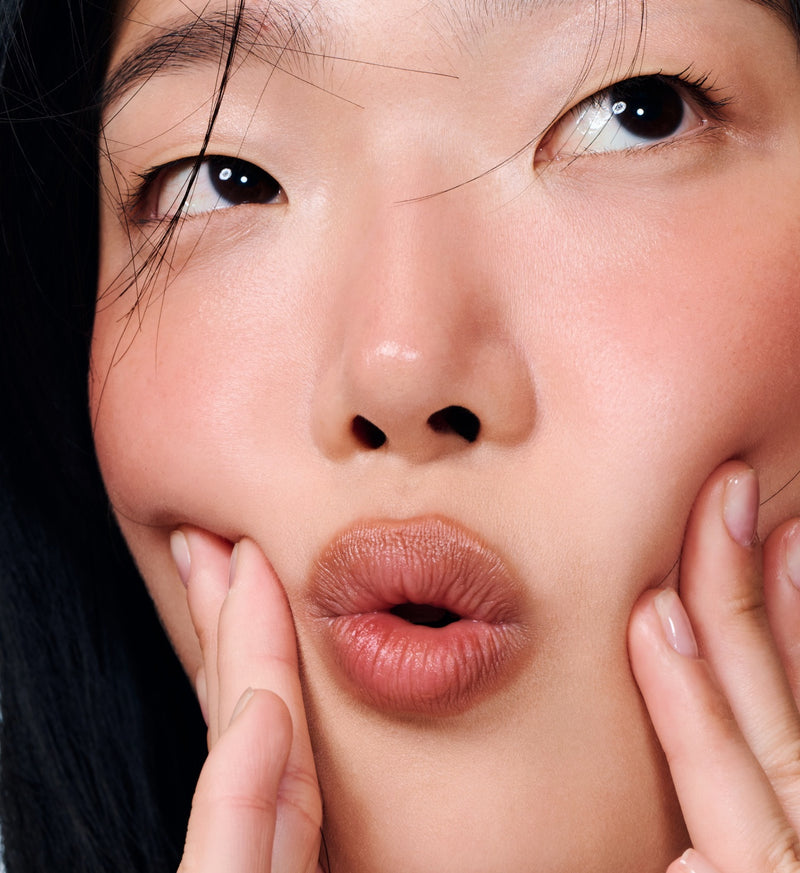 Tap on Pocket Blush to the center of your lips for creamy color.