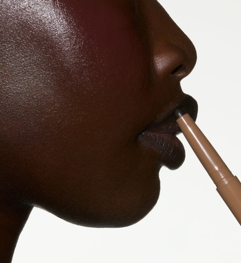 Glide Peptide Lip Shape along the outline of your lips.