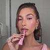 Video of Hailey Bieber applying ribbon lip tint on lips