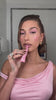 Video of Hailey Bieber applying ribbon lip tint on lips