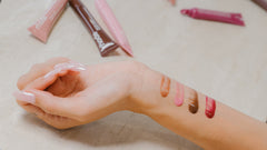 Arm swatch of all 4 shades of Peptide Lip Tint - in shades Ribbon, Toast, Raspberry Jelly, and Espresso 