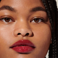 model wearing peptide lip tint in raspberry jelly