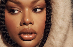Model wears Peptide Lip Tint in shade Toast
