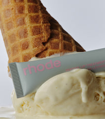 rhode vanilla peptide lip treatment on top of a scoop of vanilla ice cream
