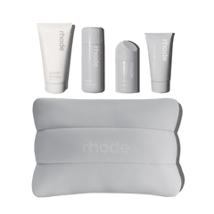 The rhode kit includes Pineapple Refresh, Glazing Milk, Peptide Glazing Fluid, Barrier Restore Cream bundled up in a rhode bubble bag.