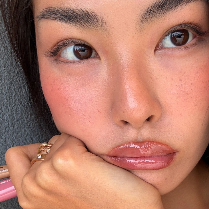 model wearing peptide lip tint in salty tan