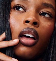 model wearing peptide lip tint salty tan