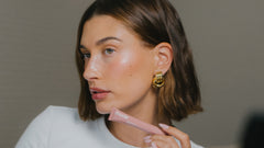 Hailey wears Peptide Lip Tint in shade Toast