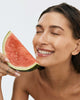 hailey bieber with watermelon, wearing peptide lip treatment (watermelon slice)