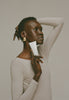 Model holding barrier restore cream, glowing skin